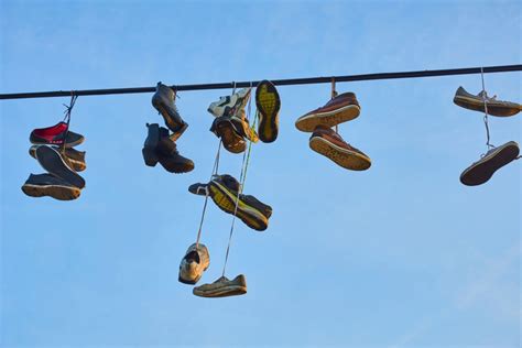 tossing sneakers over power lines.